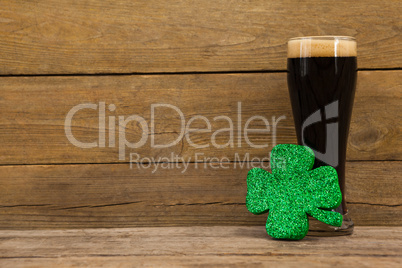 Glass of black beer and shamrock for St Patricks Day