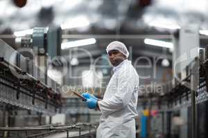 Factory engineer using digital tablet in the factory