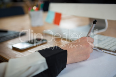 Female graphic designer working at desk