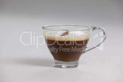 Transparent coffee cup with creamy froth