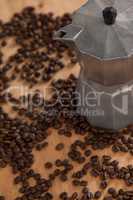 Metallic coffee maker with coffee beans