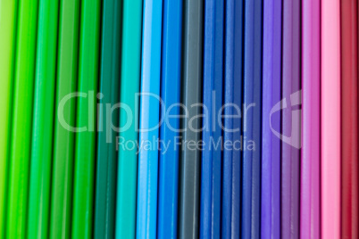 Close-up of colored pencil arranged in a row