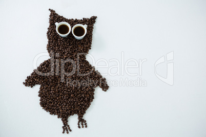 Coffee beans forming owl shape