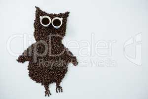 Coffee beans forming owl shape