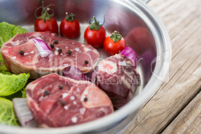 Sirloin chops and vegetables in frying pan