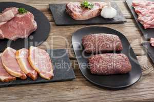 Varieties of meat on black tray