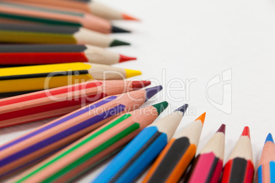 Colored pencils arranged in a semi-circle