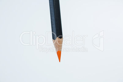 Orange color pencil on white background
