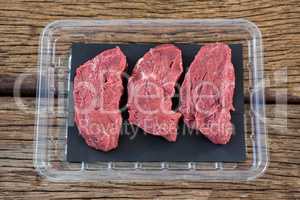 Beef steak in plastic box