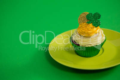 St Patricks Day shamrock on the cupcake kept in plate