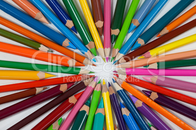 Close-up of colored pencils arranged in a circle