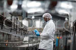 Factory engineer using digital tablet in the factory