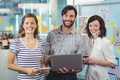 Team of business executives standing together in office