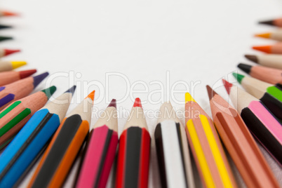 Colored pencils arranged in a semi-circle