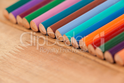 Close-up of colored pencil in a row