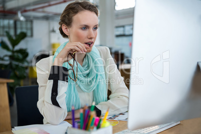 Female graphic designer working at desk