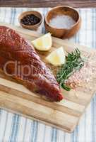 Beef steak and ingredients on wooden board