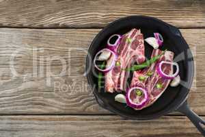 Blade chop and chopped chillies and onions in frying pan