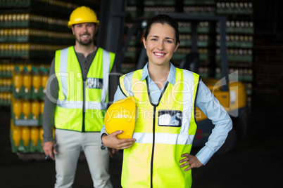 Portrait of factory workers standing in drinks production factory