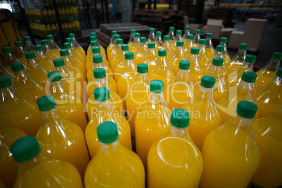 Close-up of juice bottles arranged in rows