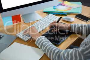 Female graphic designer working at desk