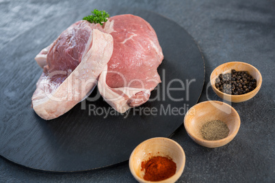 Sirloin chop and bowls of spices