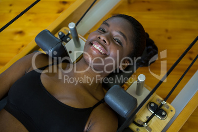 Woman practicing pilates on reformer