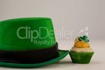 St Patricks Day leprechaun hat with shamrock on cupcake