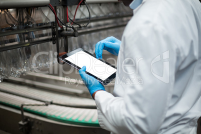 Factory engineer using digital tablet in the factory