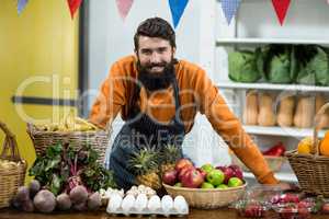 Vendor standing at the counter in grocery store