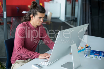 Male executive working on personal computer