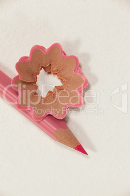 Close-up of pink colored pencil with shavings