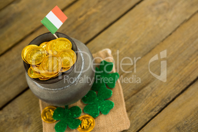 St. Patricks Day shamrock, flag and pot filled with chocolate gold coins