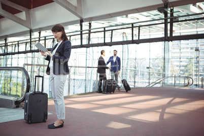 Businesswoman using digital tablet on platform