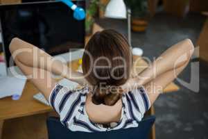 Female graphic designer relaxing on chair