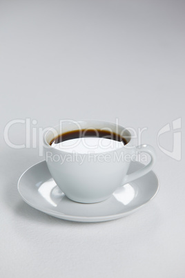 Black coffee served in white cup