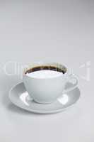 Black coffee served in white cup