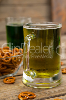 St Patricks Day two mugs of beer with pretzel