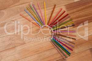Colored pencils arranged in a semi-circle