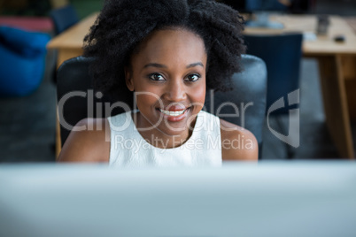 Female graphic designer using desktop pc