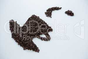 Coffee beans forming cup and saucer shape