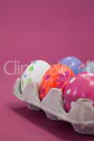 Colorful Easter eggs in egg carton