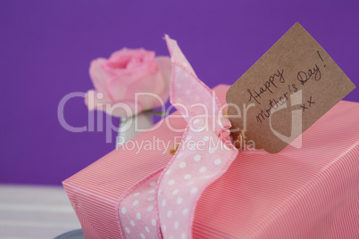 Close-up of happy mothers day card with gift box