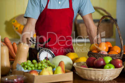 Staff standing at counter in market