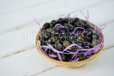 Chocolate Easter eggs in wicker basket