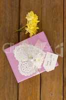 Happy mothers day card on gift box with flowers