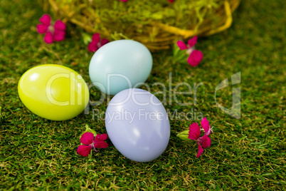 Multicolored Easter egg on grass