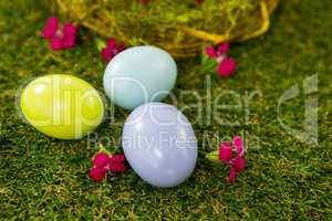 Multicolored Easter egg on grass