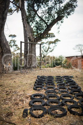 Boot camp with tyres obstacle course and fitness trial