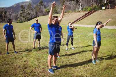 Fit people exercising in boot camp